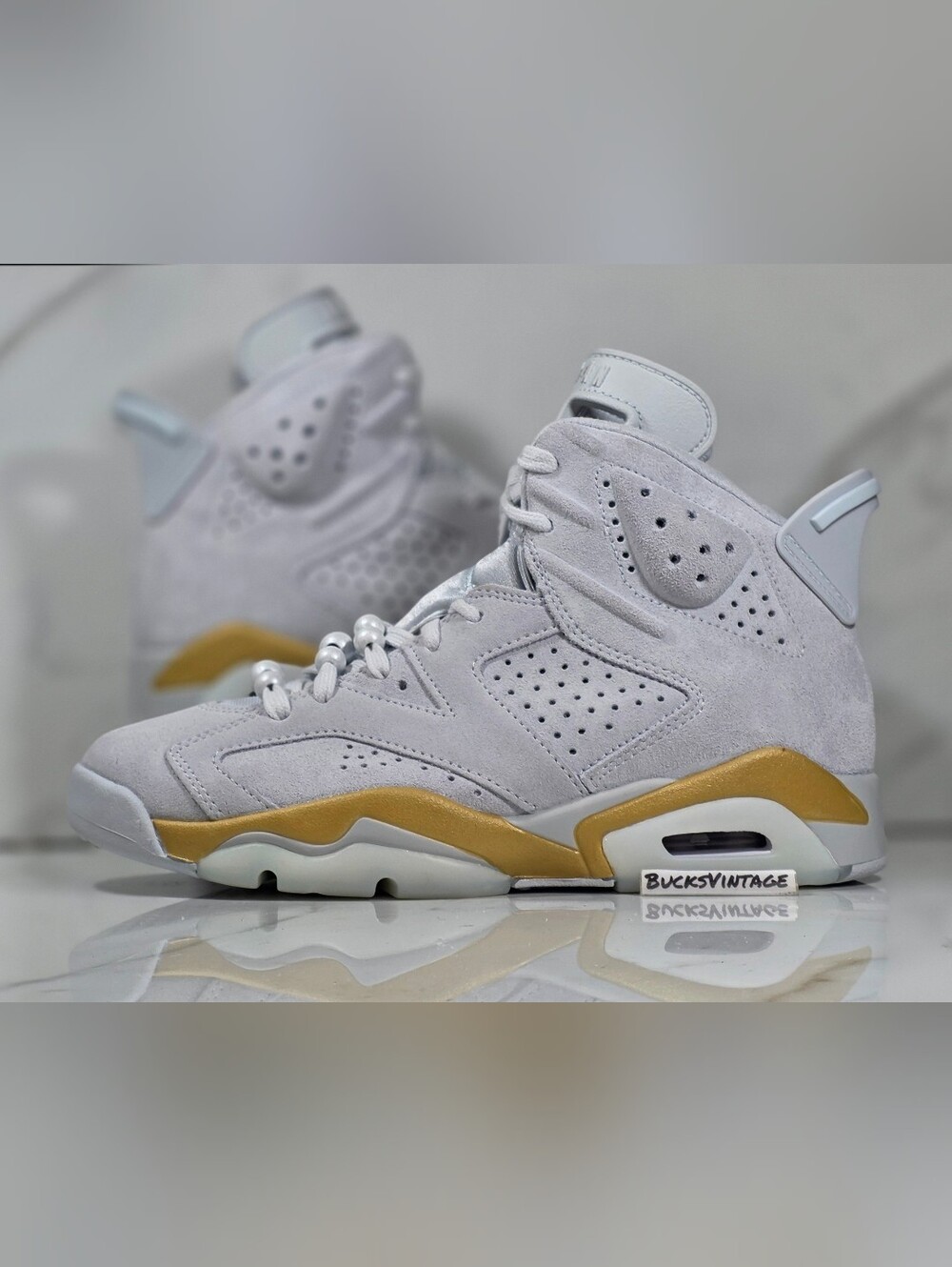 Nike Air Jordan 6 Retro White and Gold Suede Athletic Sneakers
